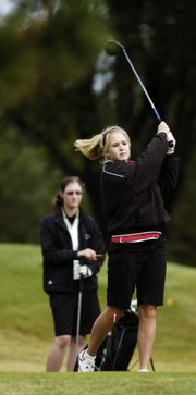 Lawrence High's Hilary Ferguson tees off on the second hole during the Class 6A regionals. Ferguson qualified for state as an individual Monday at Alvamar Golf Course.