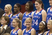 Marija Zinic (bottom center) jokes around with her teammates as they prepare for the official Kansas women's basketball team photo on Wednesday at Allen Fieldhouse. The Jayhawks met with the media to talk about the upcoming basketball season.