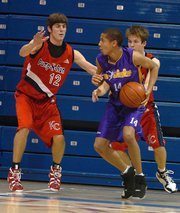 Kansas freshman Conner Teahan (12) defends Sooy No Limit's Vernell Jones, right, during a Jayhawk Invitational basketball game at Allen Fieldhouse.