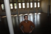 Jordan Yochim, assistant director OF the biodiversity Institute is shown in the renovated space of Spooner Hall. The hall has been converted into the Commons, an area for different branches of the university, including the Hall Center for the Humanities, the Biodiversity Institute and the Spencer Museum of Art. "People shouldn&squot;t be afraid to come up the hill, and people on the hill shouldn&squot;t be afraid to talk to one another," Yochim said. "We&squot;d like to create a place where it&squot;s easy."