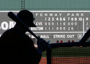 Boston's Julio Lugo waits to hit during practice. Monday, a day after the Red Sox won the ALCS, about half the team showed up at Fenway Park in Boston for an optional workout. Game 1 of the World Series is Wednesday in Boston.