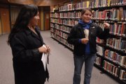 Lori Tapahonso, public information officer at Haskell Indian Nations University, and her daughter, Chamisa Edmo, talk about the spirit who allegedly haunts the library in Haskell's Tommaney Hall. The building will be one stop on the haunted Haskell tours on Wednesday night.