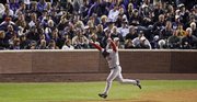 Boston's Bobby Kielty reacts after hitting a pinch-hit home run during the eighth inning. The homer proved decisive in the Red Sox's 4-3 victory over the Rockies in Game 4 of the World Series Sunday in Denver.