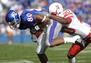 KU freshman wide receiver Dezmon Briscoe, left, latches on to a pass Satuday, Nov. 3, 2007 as Nebraska's Tierre Green closes in on the tackle.