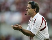 Alabama coach Nick Saban applauds his team. Saban had his former team, LSU, on the ropes, but the Tigers rallied to win Saturday in Tuscaloosa, Ala.