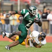 Northwest Missouri State's Xavier Omon makes a Missouri Western player miss during their game Sept. 15. Omon, a former Lawrence resident, is 17 yards away from becoming the first NCAA player to rush for 1,500 yards in four seasons.