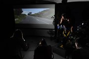 JBrennan Shirk, owner of Induro Cycling Studios, leads a group of indoor cyclists at the ICS studio. In addition to playing music, Shirk projects video tours and photographs of exotic destinations during the cycling class, which meets at the Kirmayer Fitness Center on the Kansas University Medical Center campus. An image of a zebra, top, comes across on the 133-inch high-def screen at the Induro Cycling Studios site.