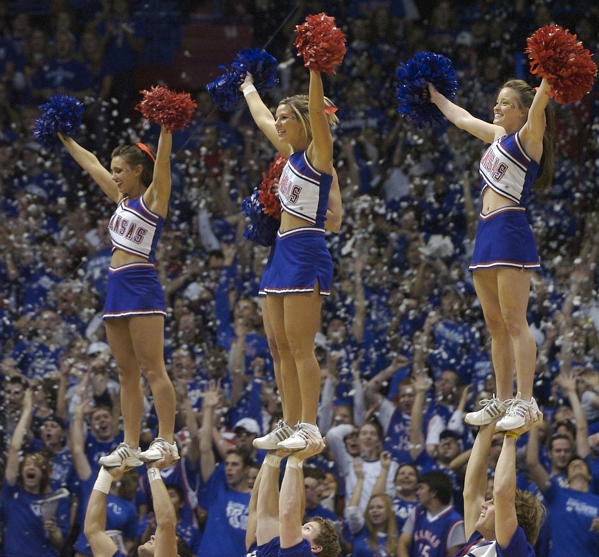Photo: Kansas cheerleaders go up to introduce the Jayhawk starting.