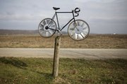 This windmill, made from a bicycle, is one of many folk art pieces that can be found at Wayne Propst's property north of Lawrence.