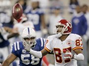 Kansas City Chiefs wide receiver Eddie Kennison (87) fumbles a punt while being tackled by Indianapolis Colts linebacker Gary Brackett. The Colts beat the Chiefs, 13-10, Sunday in Indianapolis.