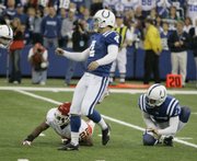 Indianapolis kicker Adam Vinatieri (4) watches his game-winning, 24-yard field goal. The kick lifted the Colts to a 13-10 victory over the Chiefs on Sunday in Indianapolis.