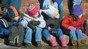 Children watch as the 14th annual Lawrence Old-Fashioned Christmas Parade passes through downtown in this 2006 file photo. This year's parade starts at 11 a.m. Saturday.