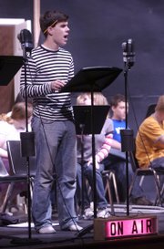 Xander Casad, a Lawrence High senior, reads the part of the older George Bailey during a rehearsal for "It's A Wonderful Life."