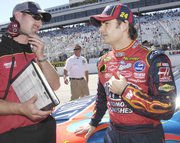 Jeff Meendering, left, talks with Jeff Gordon before the start of the 2007 Lennox 300. Meendering was named crew chief for Bobby Labonte's No. 43 Dodges.