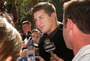 Florida quarterback Tim Tebow speaks with members of the media. Tebow returned to Gainesville, Fla., Tuesday after winning the Heisman Trophy on Saturday night. He was named the Associated Press first-team All-America quarterback.