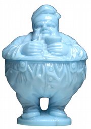 Charlot, a French comic-book character inspired by Charlie Chaplin, is the name of this blue glass sugar bowl. It is pictured in the 1933 Portieux catalog. Cowan's Auctions in Cincinnati sold it for $1,840 a few months ago.