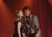 John C. Reilly, right, and Jenna Fischer star in "Walk Hard: The Dewey Cox Story," a sendup of Hollywood
biopics of musicians.