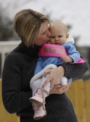 Nora Steinle, here with her mother, Dee, was the first baby in Lawrence born in 2007. Nora's introduction to the world wasn't easy; she was rushed to Children's Mercy Hospital in Kansas City, Mo., because of oxygen deprivation. But now, Nora is a thriving toddler.
