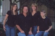 From left are Lauren, Bill, Cindy and Tyler Self. Cindy and Bill met in 1984 in Lawrence, when she was cheering and Bill was playing for the Oklahoma State Cowboys. Oklahoma State lost to Kansas University that night, but the two were later introduced at the Mad Hatter.