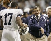 Penn State coach Joe Paterno, right, makes a comment to Penn State quarterback Daryll Clark (17). The Nittany Lions won in Paterno's 34th bowl appearance, 24-17 over Texas A&M, Saturday in San Antonio.