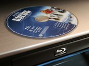 Warner Bros. Entertainment will release high-definition DVDs exclusively in the Blu-ray disc format, the company said Friday, becoming the latest studio to favor Blu-ray over the rival HD DVD technology.