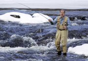 Fly fisherman Lou Ureneck, the author of "Backcast," fishes in the Royal River in Yarmouth, Maine. Ureneck wrote the book about a trip he and teenage son Adam took through the Alaskan wilderness.