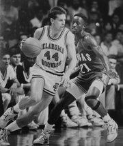 Oklahoma's Dave Sieger attempts to drive around KU's Milt Newton during the NCAA title game on April 4, 1988 in Kansas City, Mo. Sieger, known as the Sooners' top sharpshooter, scored 22 points in the 83-79 loss, including seven three-pointers.