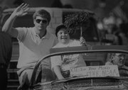 Ryan Gray celebrates during the 1988 parade for the Kansas University championship basketball team. At left is John Robic, who is currently an assistant coach for John Calipari at Memphis.