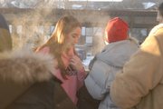 Residents huddle together outside in 2 degree temperatures after their leaving their apartment building, which caught fire about 6 a.m. Saturday. Lawrence-Douglas County Fire & Medical responded to the fire. Investigators have not determined the cause of the fire, but witnesses say it began when a mattress came in contact with a burning candle.