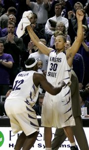 Kansas State forward Michael Beasley (30) celebrates with Bill Walker (12) after the Wildcats' victory over then-No. 10 Texas A&M. Beasley, KSU's freshman star, has guaranteed a victory against No. 2 Kansas on Wednesday.