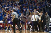 The K-State bench leaps onto the court after defeating Kansas. The Wildcats won two seasons ago in Allen Fieldhouse.