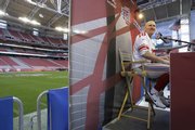 New York Giants' Jeff Feagles answers a question during Super Bowl media day. Feagles nearly retired two years ago.