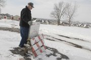Bill Naff, whose property is near Sixth Street and Queens Road on the western edge of Lawrence, has built a sign informing others where his property begins.