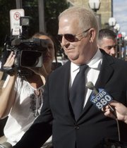 The Rev. Michael Jude Fay, former pastor of St. John Roman Catholic Church in Darien, Conn., leaves U.S. District Court in New Haven, Conn., in this Sept. 12, 2007, file photo. Fay pleaded guilty to interstate transportation of money obtained by fraud.