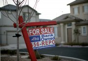 A bank-owned home was for sale last week in Las Vegas. In states hardest-hit by the housing bust, foreclosed homes represent a growing share of homes sold, and that number has risen above 50 percent lately in particularly hard-hit cities.