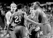 Jayhawks, from left, Chris Piper, Milt Newton, Scooter Barry and Danny Manning huddle during their semifinal victory over Duke in Kansas City, Mo.