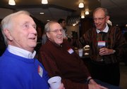 Former KU radio announcer Max Falkenstien, left, visits with ex-Jayhawk players Clyde Lovellette, center, and Jerry Waugh on Friday night at Lawrence Country Club.
