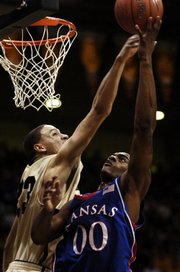 Colorado standout Richard Roby, left, tries to block a shot by Kansas University's Darrell Arthur in this Feb. 2 file photo. Roby has performed well against Kansas, but has an 0-7 record to show for it heading into today's KU-CU game.