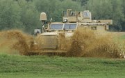 A Category I mine-resistant ambush-protected (MRAP) vehicle, is driven on a test course during a media demonstration at the Aberdeen Proving Ground in Maryland in this Aug. 24, 2007, file photo. An internal military study concluded that hundreds of Marine lives could have been saved from road bombs in Iraq if bureaucrats had not refused a 2005 request for blast-resistant vehicles.