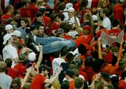 Texas Tech students rush the court to celebrate their upset victory against the Texas Longhorns. It was the first time Texas Tech defeated Texas at home since 2005. Texas Tech won, 83-80, in Lubbock, Texas.
