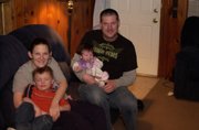 After surviving heart bypass surgery and five heart stoppages that stemmed from complications from the birth of her second child, Tara Dalton looks forward to regaining the strength to care for her family. With Dalton is her son Evan Murphy, her fiance, Keith Hutchings, and their daughter, Aspyn Hutchings.