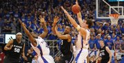 Kansas defenders Sherron Collins, left, and Sasha Kaun force a turnover from Kansas State guard Clent Stewart during the first half of the Jayhawks' 88-74 victory Saturday at Allen Fieldhouse. Kaun is one of five seniors who will be honored at tonight's Senior Night game against Texas Tech.