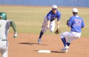 KU's Erik Morrison (10) works a double play with teammate Robby Price (37) Sunday afternoon against North Dakota State.