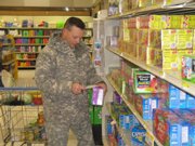 Maj. Scott Holland, of Lansing, shops at Fort Leavenworth's commissary. Holland and his wife said they've seen price increases for some basic items like meat, milk and produce at the grocery store for military personnel. Holland said prices generally are significantly less at the commissary than at grocery stores off-post.