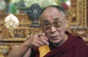 China is mounting a huge buildup of troops around Tibet and is warning tourists and journalists to stay away. The Dalai Lama, at left, has offered to meet with Chinese President Hu Jintao, but China has repeatedly ignored calls for dialogue, accusing the exiled Tibetan leader of organizing violence in hopes of sabotaging the upcoming Beijing Olympics.