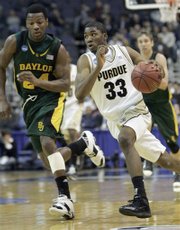 Purdue guard E'Twaun Moore drives past Baylor guard LaceDarius Dunn during second half action in a first round NCAA West Regional basketball game, Thursday March 20, 2008 in Washington. Purdue defeated Baylor 90-79.AP Photo/Susan Walsh