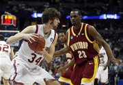 Winthrop forward Taj McCullough, right, comes in to cover Washington State forward Robbie Cowgill as he pulls down a rebound in the second half of a first-round NCAA East Regional basketball game in Denver on Thursday, March 20, 2008. Washington State defeated Winthrop 71-40.
