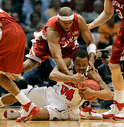 Louisville's Jerry Smith (34) covers a loose ball as Oklahoma's David Godbold defends in the first half of a Second Round NCAA East Regional basketball game in Birmingham, Ala., Sunday, March 23, 2008.