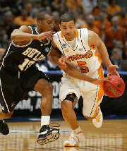 Tennessee's Chris Lofton, right, drives as Butler's Mike Green defends in the first half of a second-round NCAA East Regional basketball game in Birmingham, Ala., Sunday, March 23, 2008.