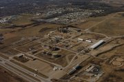 This aerial view looks northwest over the former Farmland Industries Inc. fertilizer plant and its surrounding 467 acres. In the foreground is Kansas Highway 10, the extension of 23rd Street east of Lawrence.